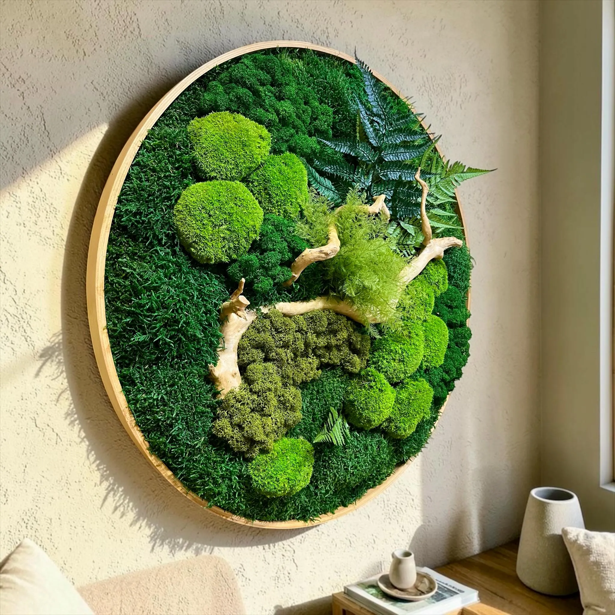Handmade luxury moss wall sculpture inspired by nature with preserved botanical elements and natural wood details.